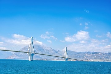 Obraz premium The famous cable bridge Charilaos Trikoupis in Rio Antirio Greece on a sunny day with a blue sky