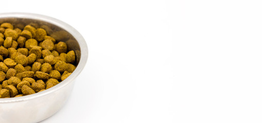 Steel bowl of pet food isolated on white background. Pets care veterinary concept. Close up. Space for text. banner