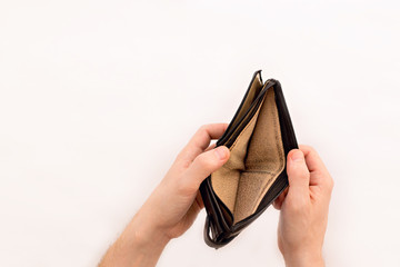 Bankruptcy. A man holds an empty wallet in his hands. Retired Poverty and Unemployment Concept.