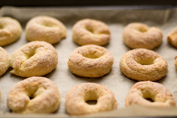 Homemade cookies. Cottage cheese rings on a baking sheet, healthy sweets. Bake at home. Family traditions. Selective focus
