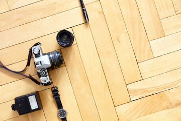 Old type photographic equipment on wooden floor