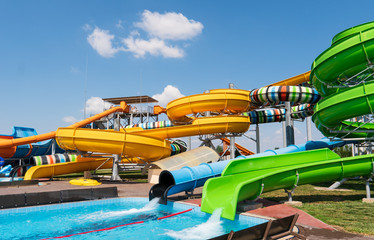 Obraz na płótnie Canvas Water park with colorful slides and pools