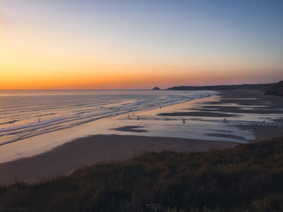 Fototapeta premium Surfers at Sunset