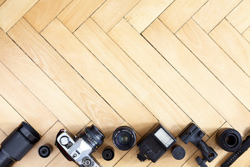 Old type photography equipment on wooden floor