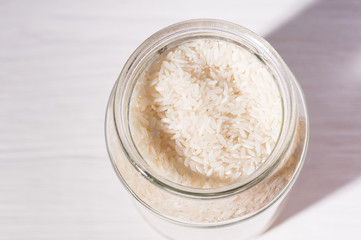 rice in zero waste shop. cereal  in glass jar on shelves. Eco friendly shopping in plastic free grocery store.