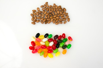 Gang of brown beans in.a stand-off with a gang of jellybeans.