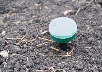 Ultrasonic repeller of moles and other rodents in action stuck in the ground. Rodent Repeller...