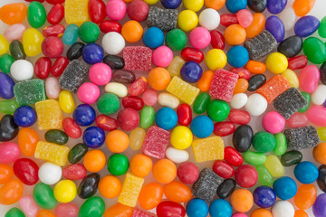 Fototapeta na wymiar Close up photo of jelly beans mixed with other small types of candies. 
