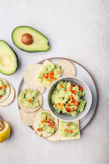 Healthy Gluten Free Snacks. Oatcakes and sea salt crackers with avocado and bell pepper mash. Ideal snack for vegans