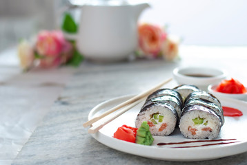 Sushi Rolls asian food stylish beautiful close up picture. Tasty delishes meals with rice and seafood on the white plate