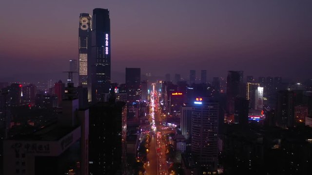 sunset time night illumination changsha city downtown main traffic street aerial panorama 4k china