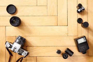 Old camera and photographic equipment on wooden floor - 350308281