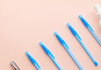 Flay lay school stationery supplies, medical masks, pen and hand gel sanitizer, school reopening, returning back to school after covid-19 coronavirus, post pandemic epidemic quarantine