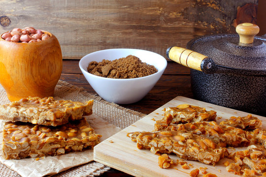 "P&eacute; de Moleque" is a typical sweet of Brazilian cuisine, made with roasted peanuts and rapadura. it is called chikki in India, nougat in Portugal and palanqueta in Mexico.