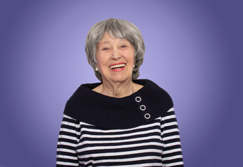 The portrait of a cheerful senior woman