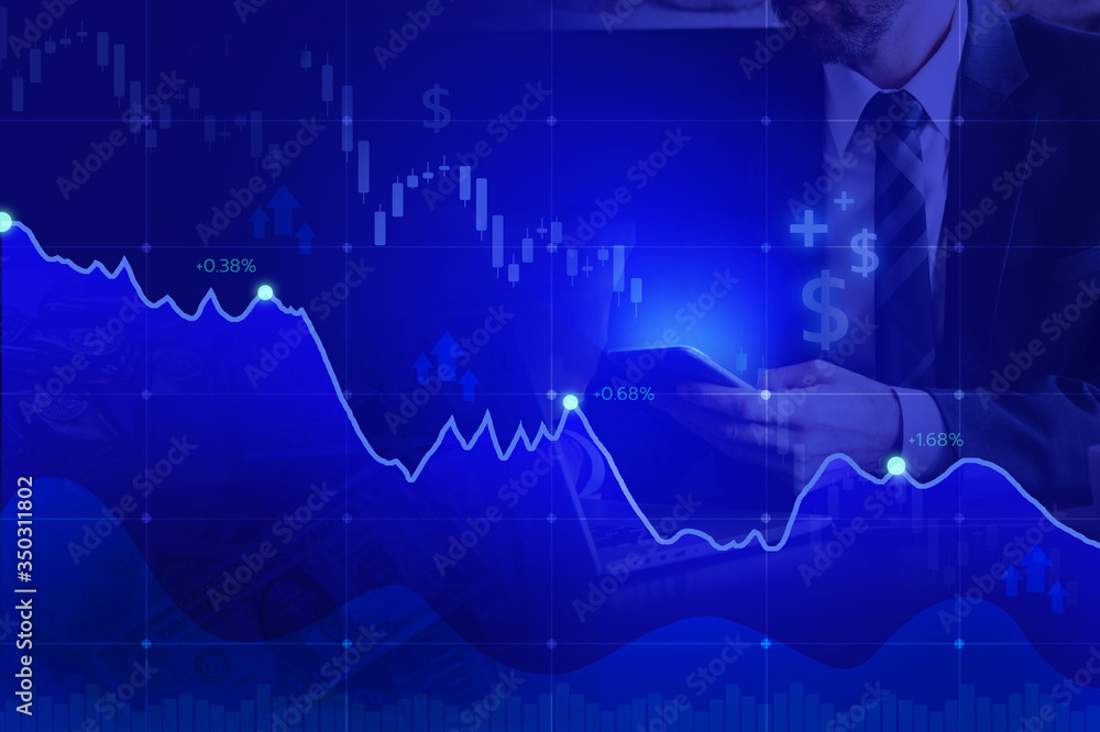 Wall mural stock market on blue color and hand mobile.