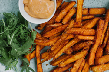 Fried fries and sauce closeup.