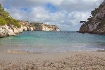 Fototapeta premium Fine sand beach between mountains