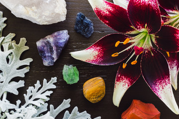Lillies with Dusty Miller and Rainbow Stones on Brown Background