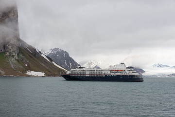 Expedition ship in Arctic sea, Svalbard. Passenger cruise vessel. Arctic and Antarctic cruise.
