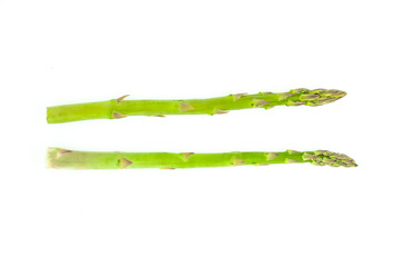 Fresh green asparagus isolated on white background. Creative healthy food concept. Flat lay.