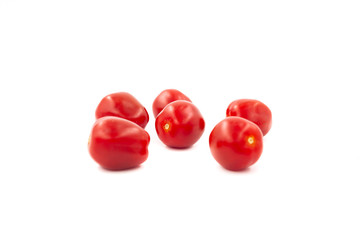 Fresh cherry tomatoes isolated on white background. Creative healthy food concept. Flat lay.