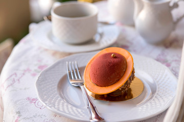 tender dessert on a white plate in a cafe