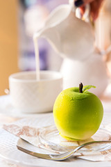 tender dessert on a white tablecloth with a cup of coffee