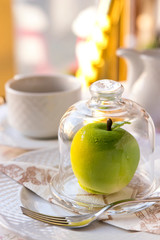 tender dessert on a white tablecloth with a cup of coffee