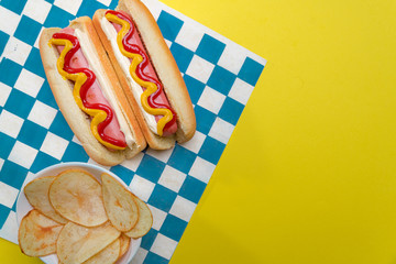 classic hot dogs with ketchup and mustard with space for creators