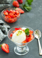 Ice cream with strawberry sauce. Selective focus