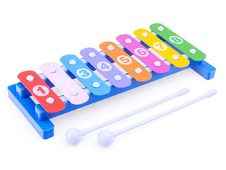 Bright toy xylophone isolated on a white background, close-up. Children's musical instruments....