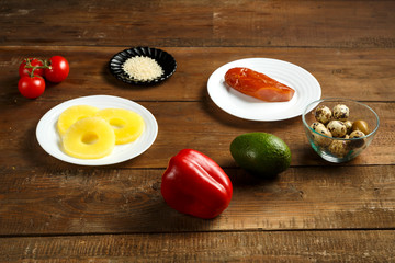 Ingredients for a pan-Asian salad are smoked chicken, pineapple, quail eggs, tomatoes and sesame.