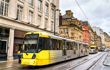 City tram in the centre of Manchester, England - obrazy, fototapety, plakaty