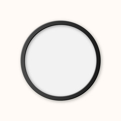 Realistic circle black plastic picture frame isolated on white background. Frame for your presentations.