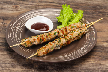 Minced pork skewer kebab with sauce
