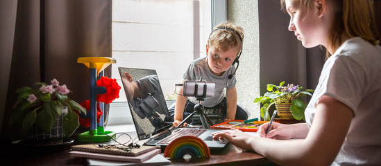 Coronavirus. Quarantine. Online training, distant remot work. Laptop and kid toys on the table. Work from home with children, home office. Workplace at home. Coronavirus pandemic in the world.Covid 19