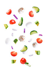 Tomato cucumber red onion mozzarella salad on a white isolated background