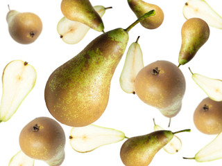 Levitation halves and a whole pear on a light background. Image with selective focus.
