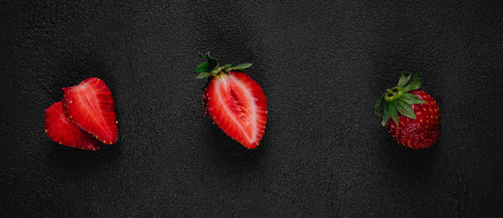 Strawberry on dark background. Top view. Copy space for text message.