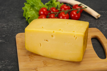 Hard yellow tasty cheese brick