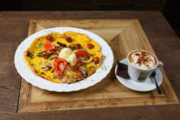 Omelet with sausages and vegetables