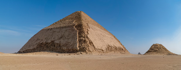 The Bent Pyramid is an ancient Egyptian pyramid located at the royal necropolis of Dahshur,...
