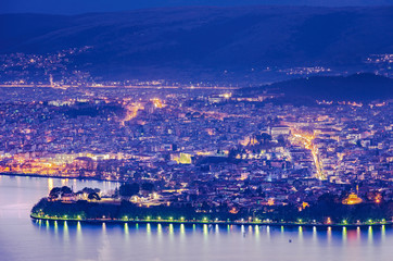 Obraz premium Aerial view of the city of Ioannina and its lights reflecting in the lake during blue hour in Epirus Greece