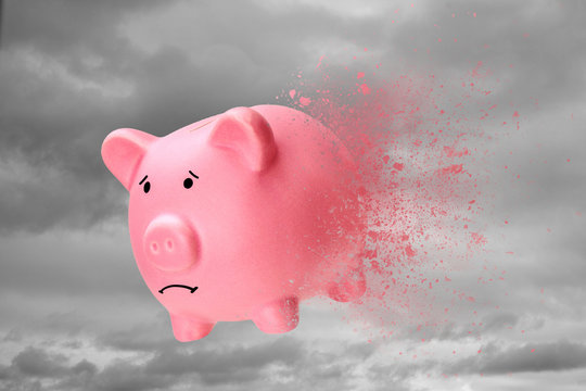 No Money Or Savings Have Disappeared. Piggy Bank Turns Into Sand Against The Sky