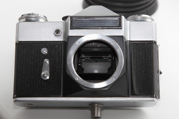 Retro SLR camera front panel with mechanical timer, light meter sensor and lens mount with shutter mirror inside