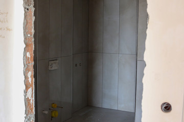 construction unfinished wall, door bathroom
