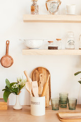 wooden rustic kitchen table. minimalistic interior, utencils on the table