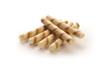 wafer rolls with cream filling on a white background