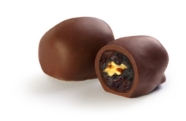 chocolate candies stuffed with dried apricots, prunes, figs and nuts, on a white background, chocolate figs, dried apricots in chocolate, chocolate prunes
